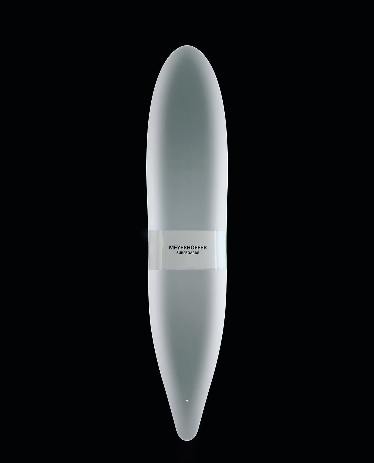 Pale Meyerhoffer surfboard, its sculptural outline illuminated against black